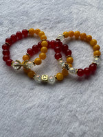 red and yellow bamboo with glass beads and gold accents women's bracelet set in size 7