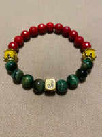 Green tigers eye with red and gold bead with initial center bead