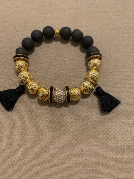 Black and gold braceket